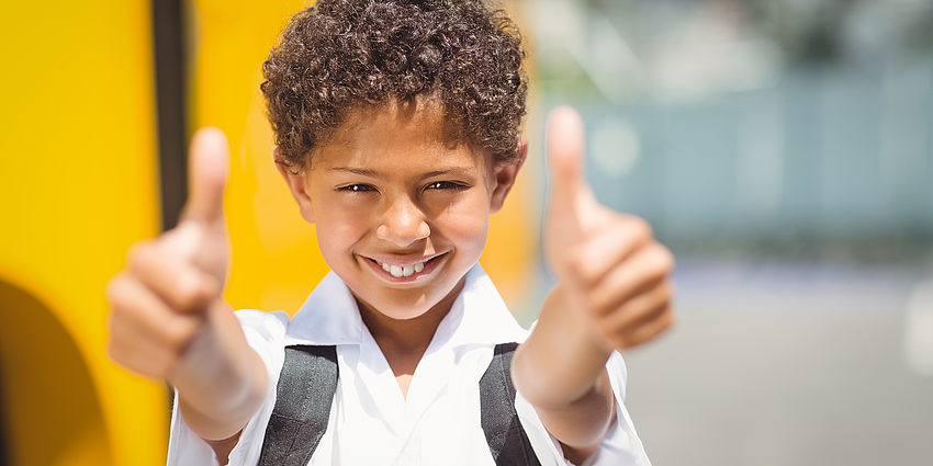 student with thumbs up