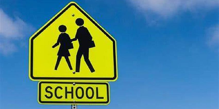 Yellow sign with "School" written on it 