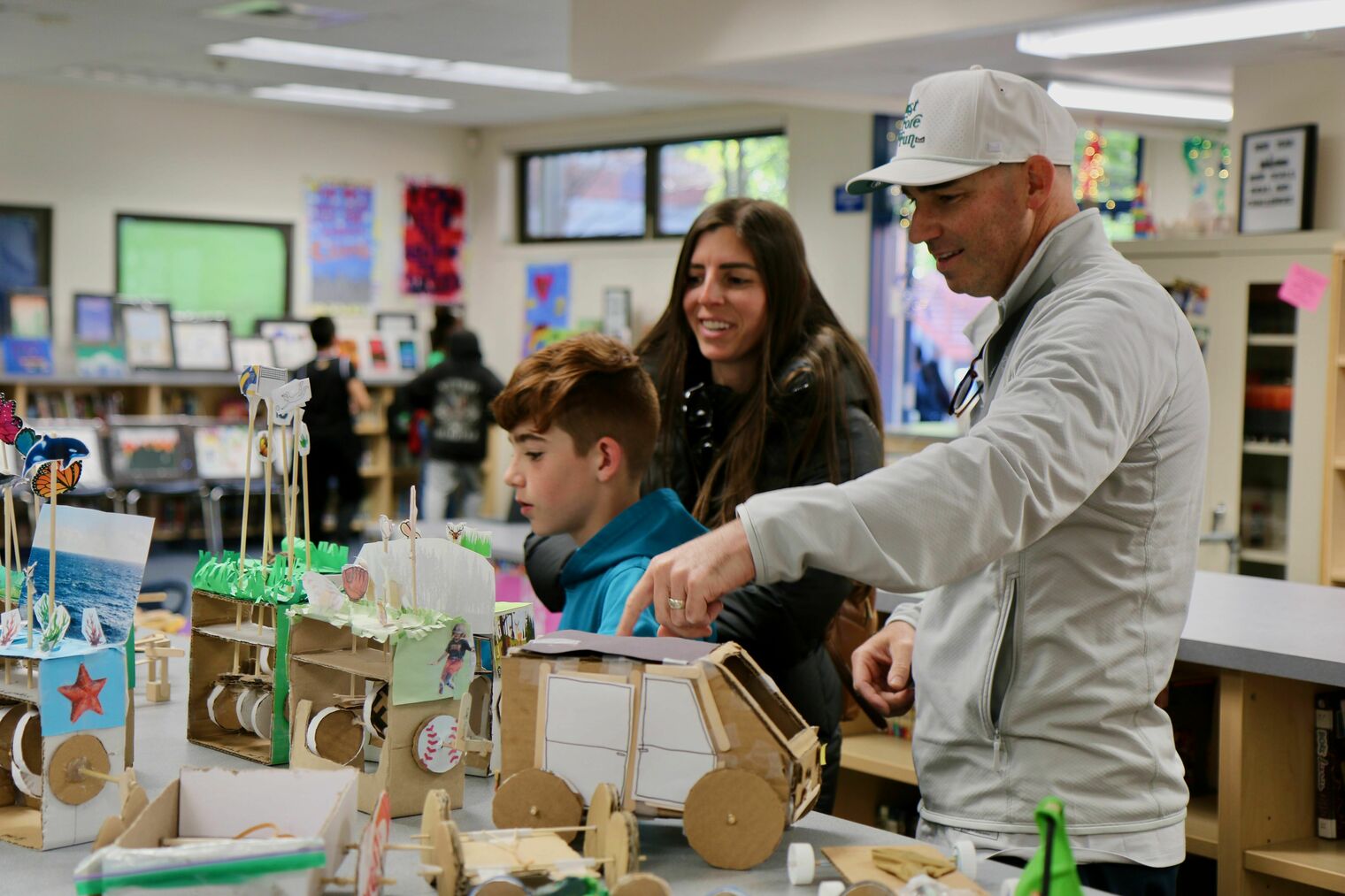 Family exploring projects at last year's AIM Showcase.