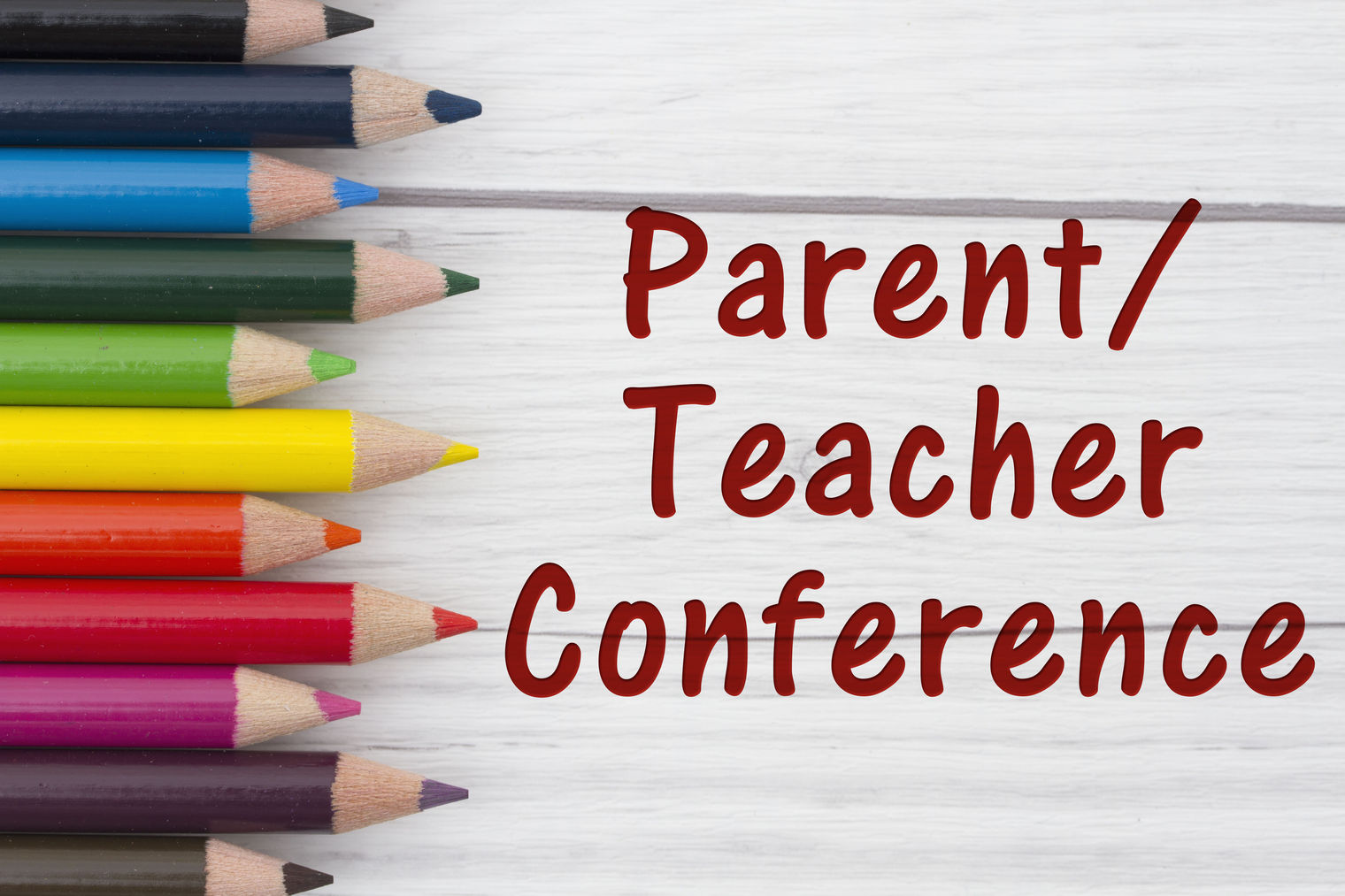 Colored pencils against white background.  "Parent/Teacher Conference"